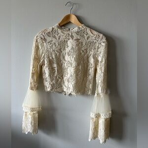 Lace cream coloured top with bell sleeves